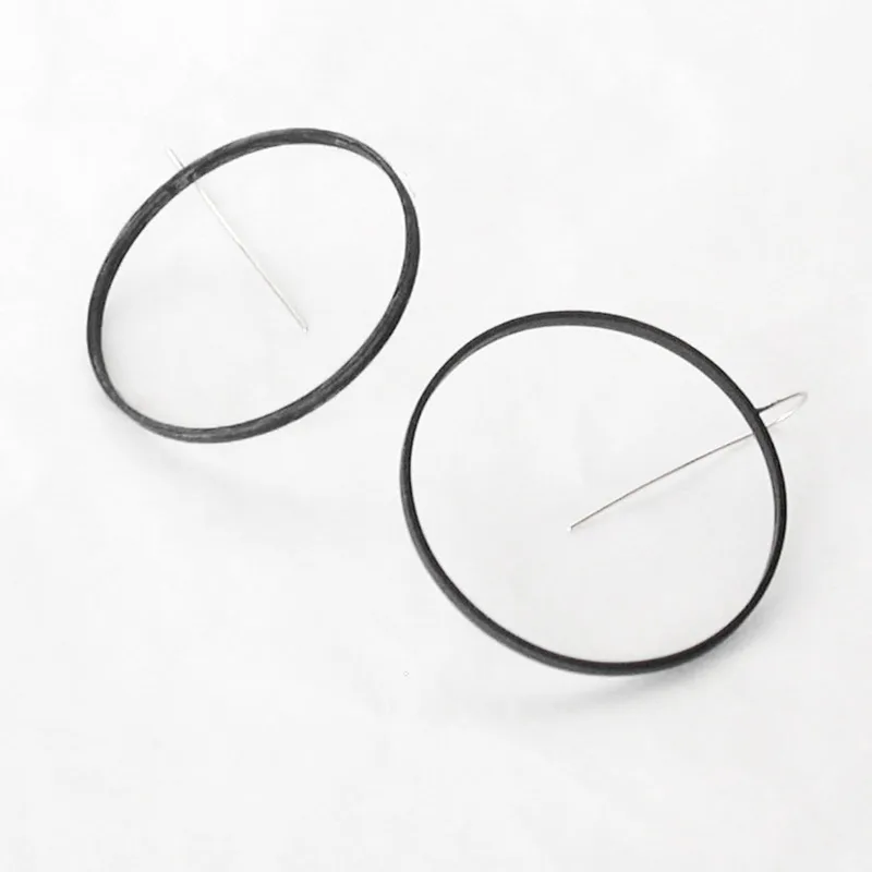 the big circles in black brass