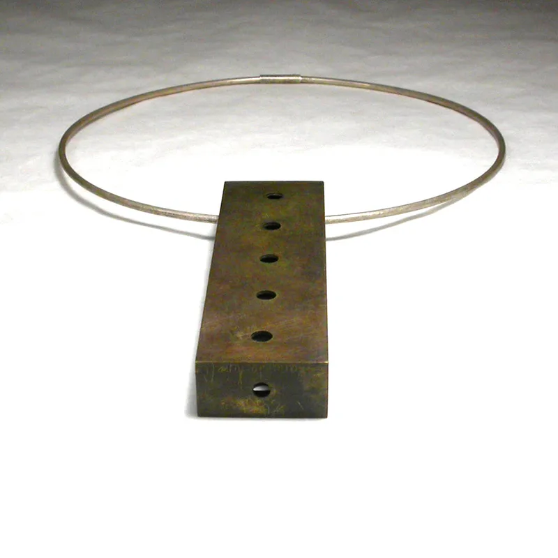 Soliloquy-Pendant-in-brass-on-a-sterling-silver-cable
